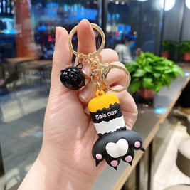 Keychain in the shape of a cat's paw with a bell - black