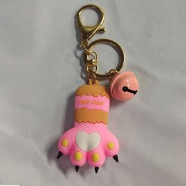 Keychain in the shape of a cat's paw with a bell - pink